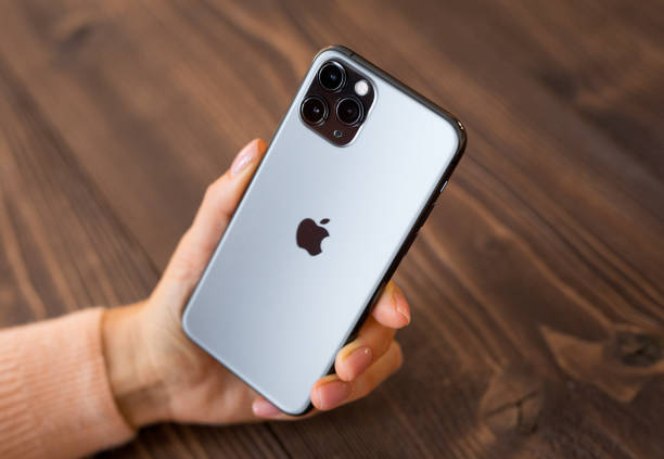 Person holding an Apple iPhone | Apple data privacy