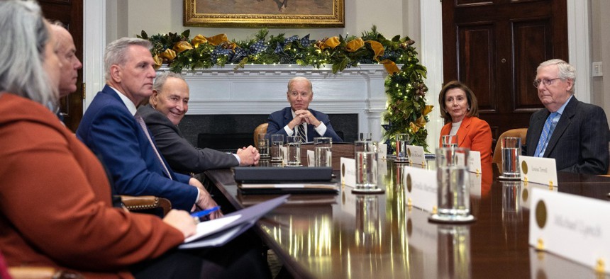 A group of US Senators discussing the spending bill, | Chuck Schumer