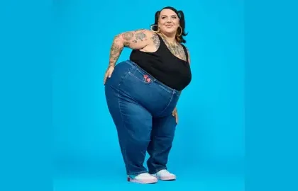 Snag model Sophie posing in blue jeans and a black vest top | Snag clothing | PGN Business Insider
