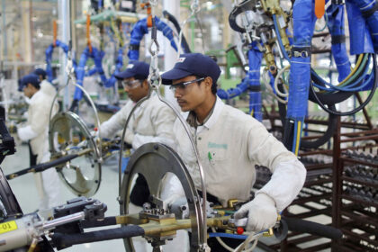 Indian workers in a manufacturing facility | Trump's tariff war | PGN Business Insider