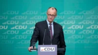 Friedrich Merz speaking at a press conference. | Germany spending deal | PGN Business Insider