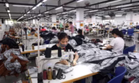 Workers sewing garments in a factory in Vietnam. | clothing tariffs | | PGN Business Insider | pottersgallerynigeria.org