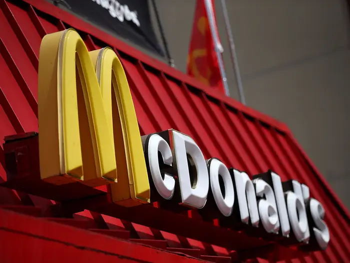 McDonald's logo displayed on a restaurant sign | McDonald's sexual abuse | PGN Business Insider
