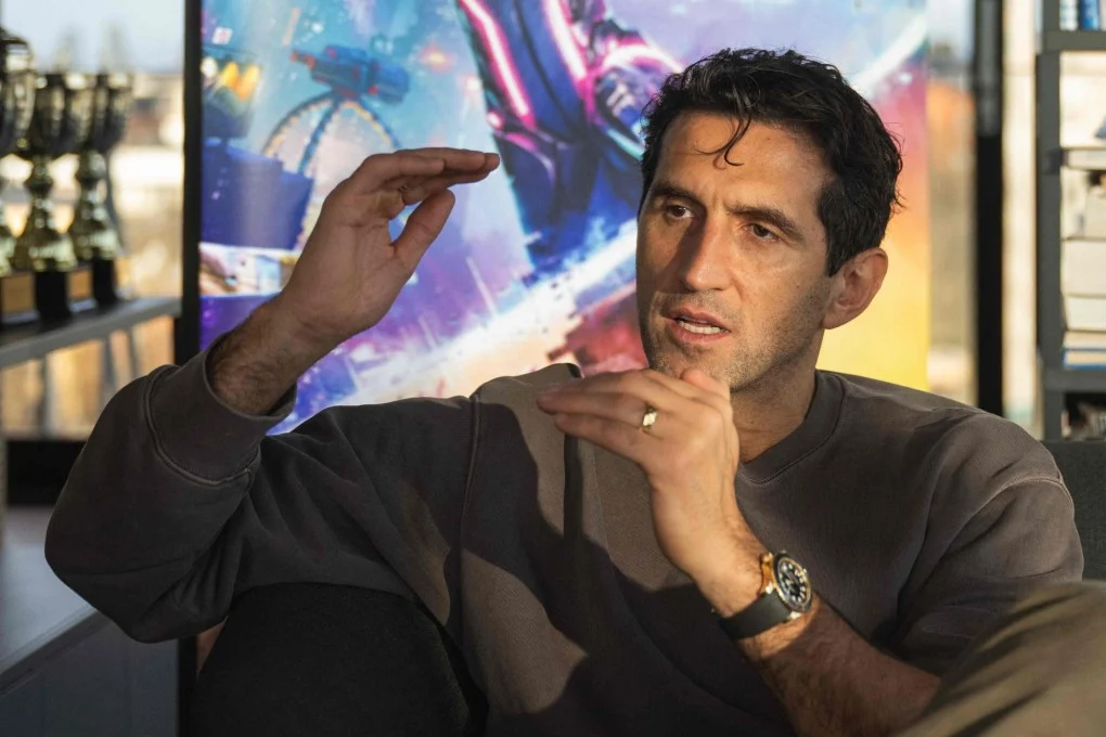 Video game director Josef Fares speaking at a conference. collaborative gaming