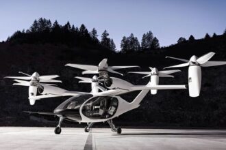 A futuristic electric air taxi taking off from a city