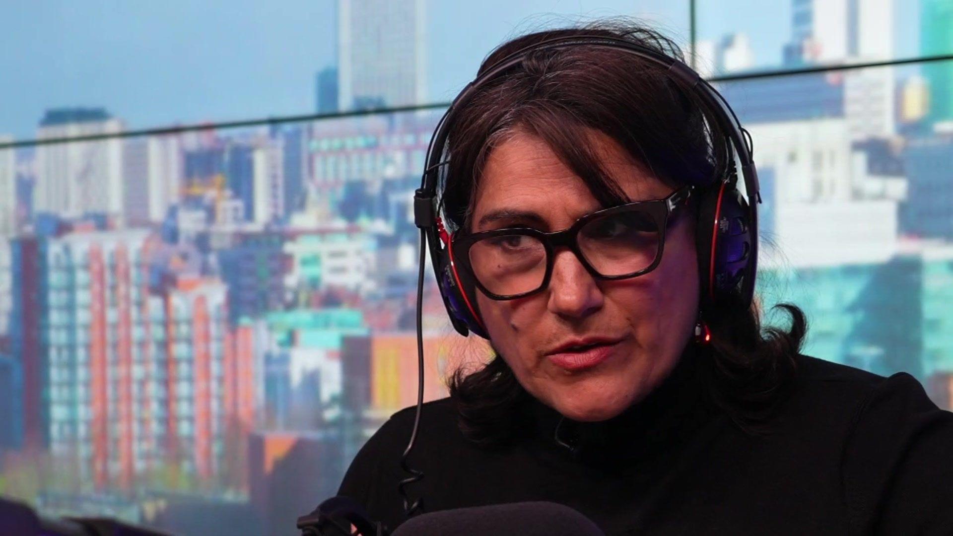 Dame Jasvinder Sanghera in a radio studio.