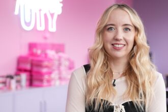 Laura Mallows demonstrates products during a TikTok Live session in her Llantrisant office.