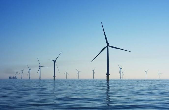 A wind turbine farm, representing BP’s scaled-back renewables strategy | BP shareholders