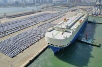 Cars await export at Yantai port, China, symbolizing US-China trade tensions, US trade policy