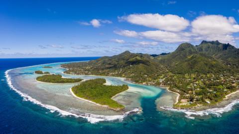 Aerial shot of the Cook Islands, symbolizing the nation’s remote location and resource wealth. | Cook Islands China Deals 