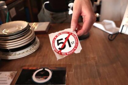 A coffee shop in Toronto hands out anti-51st state stickers to customers. Canadian boycott