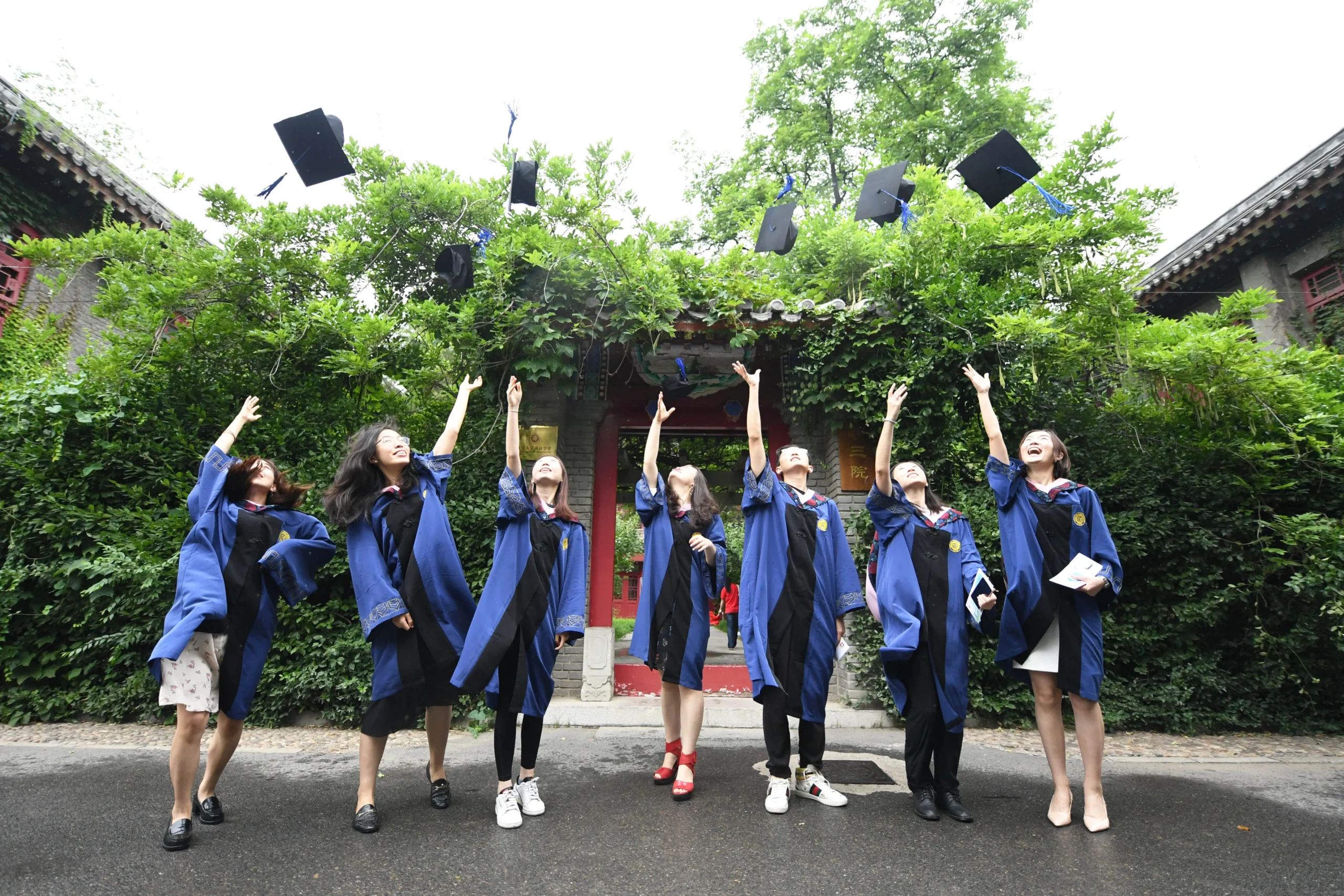 A group of Chinese students graduating with STEM degrees, highlighting national talent. China AI