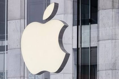 Apple logo on a store wall, symbolizing the tech giant’s Apple encryption battle..