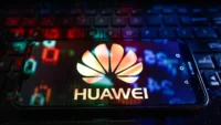 Huawei logo displayed on a smartphone screen | Huawei corruption allegations