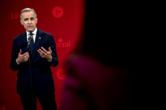 Mark Carney speaking at a press conference