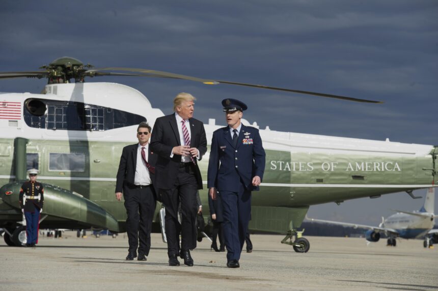 President Donald Trump boards Air Force One at Joint Base Andrews in Maryland, pumping his fist in determination as he prepares to address the nation on economic policy. | US economy