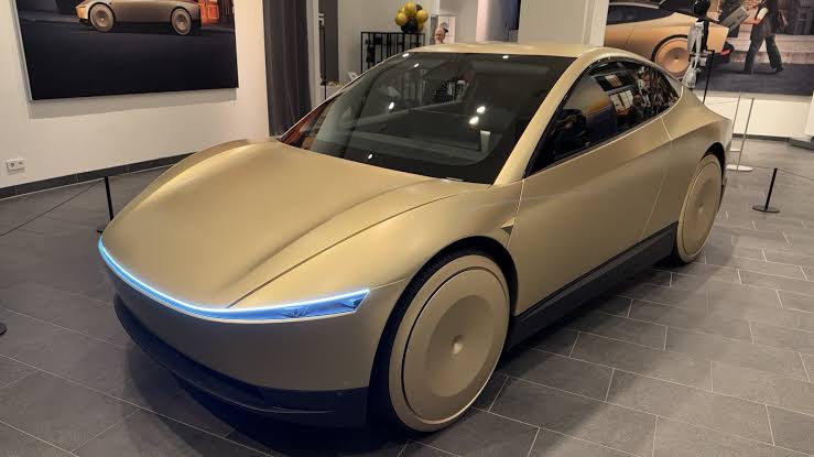 Tesla CyberCab displayed at a Berlin auto show, Tesla EVs